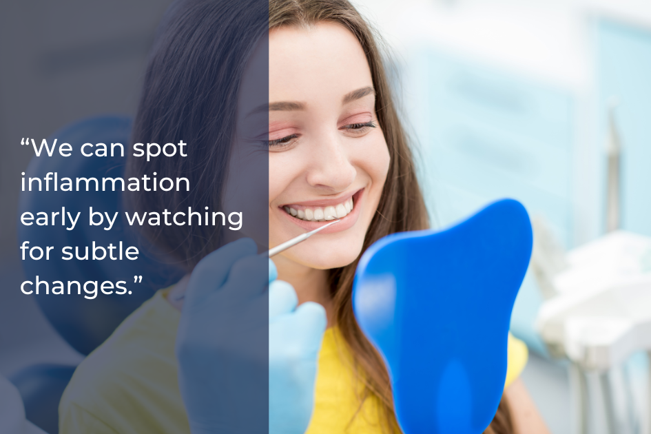 A woman at a dental appointment in Austin, TX smiles while holding a blue mirror; a dentist holds a dental tool near her mouth. Text reads, “We can spot gum inflammation early by watching for subtle changes.”.